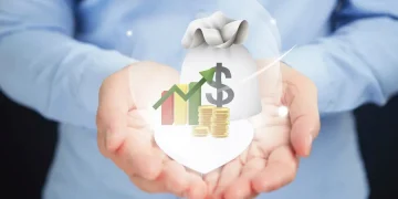 Hands holding a money bag and a dollar sign growth chart, illustrating how to maximize 401(k) matching contributions.